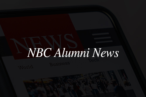 smartphone with news page opened with text overlay reading 'NBC Alumni News'
