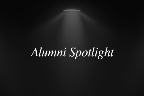 dim spotlight with text overlay reading 'Alumni Spotlight'